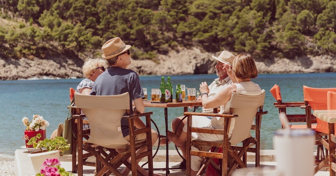 Senior couple enjoying coffee at a seaside cafe