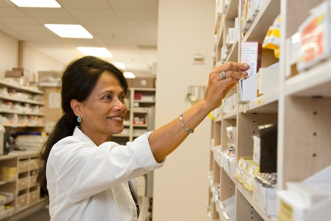 Senior woman receiving a discount at a pharmacy counter