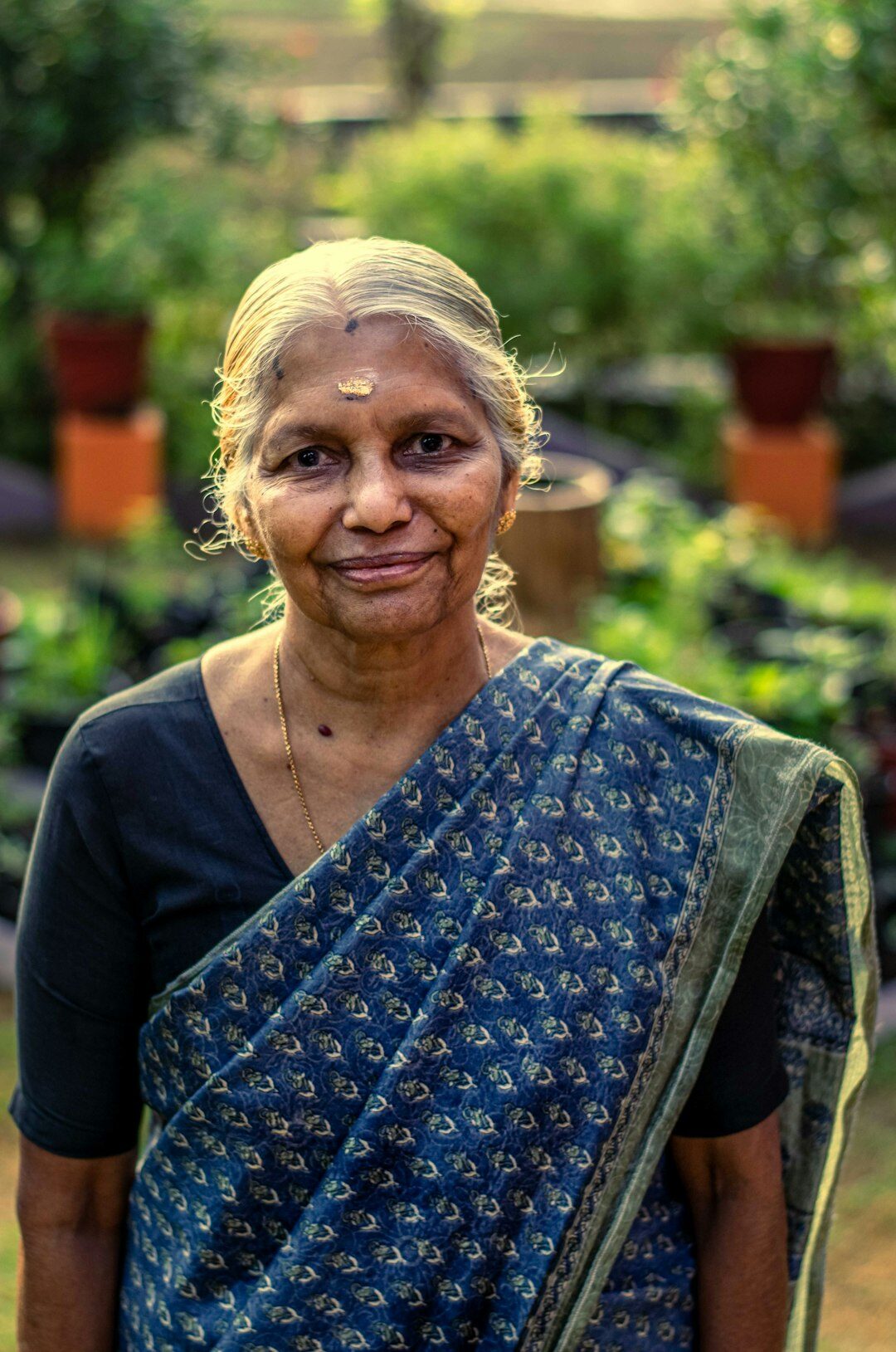 Portrait of a warm senior woman founder smiling